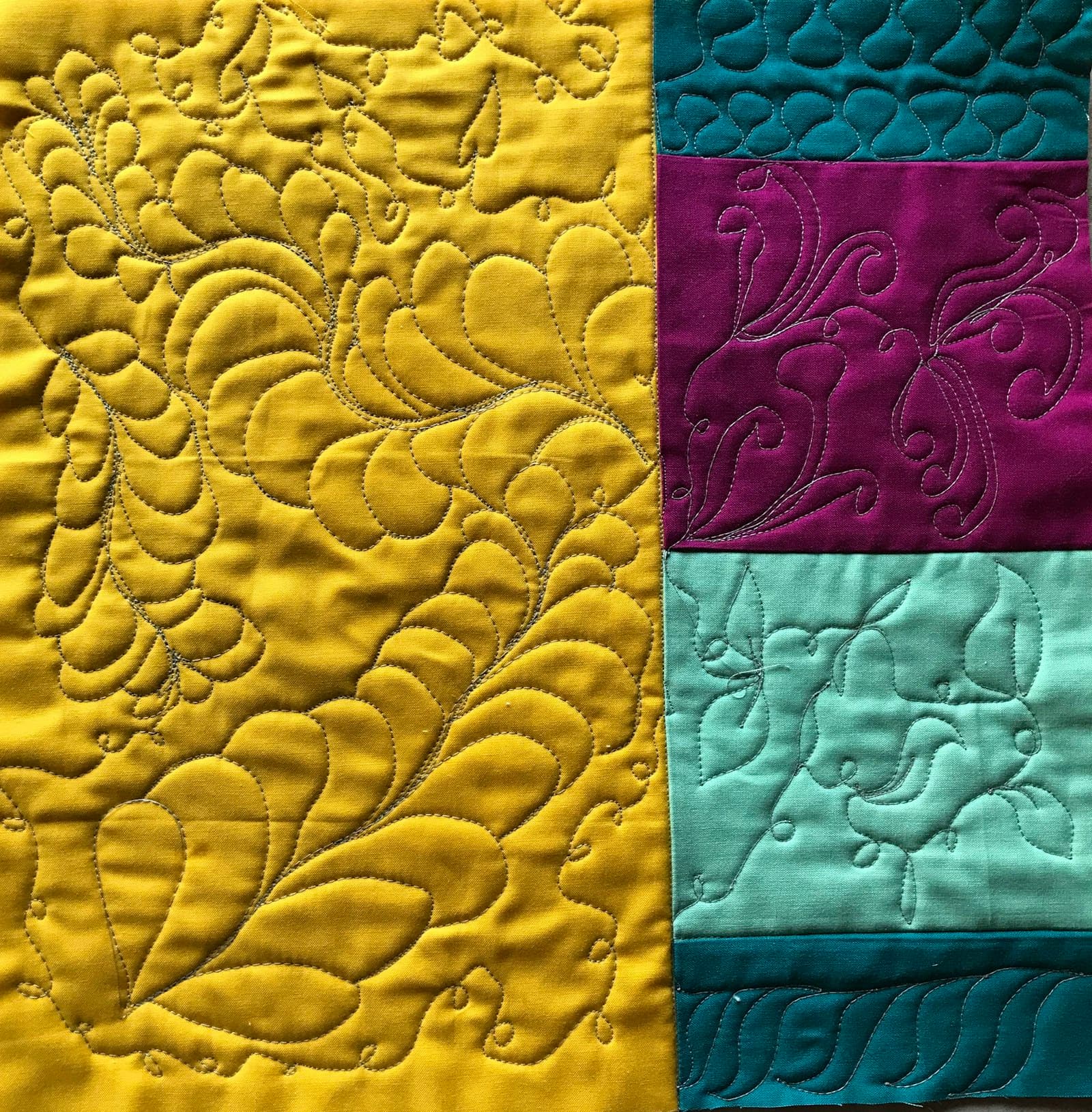 Close-up of a green and beige floral textile