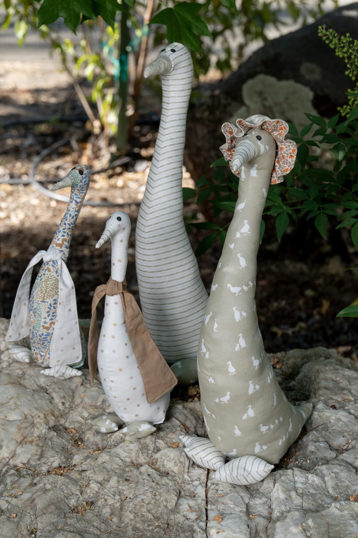 Handmade fabric goose figures displayed outdoors